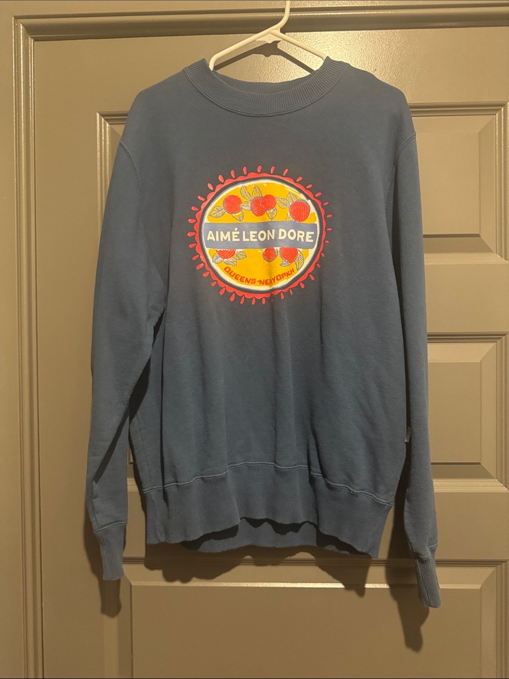 Aime Leon Dore Navy Sweatshirt with Yellow and Red Emblem